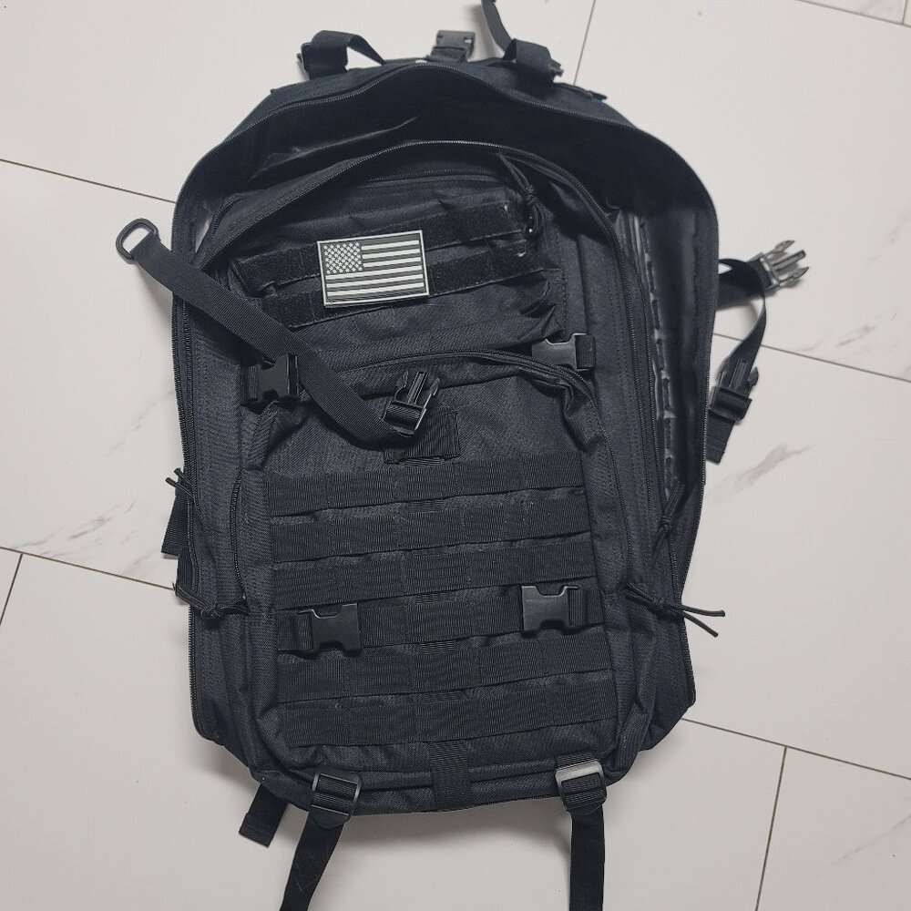 Black tactical backpack with many pockets